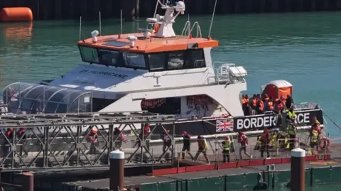 Initial UK Legal Objection Lodged Against 'One In, One Out' Deal